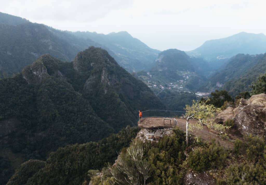 A drone view of Levada Dos Balcões in Madeira. Caleb is standing at the end of the trail admiring the view of the valley