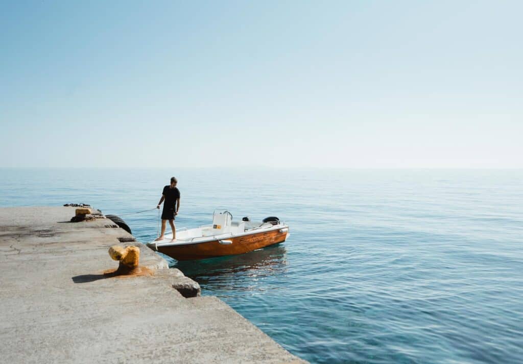 caleb docking our boat rental on the southern coast of Crete