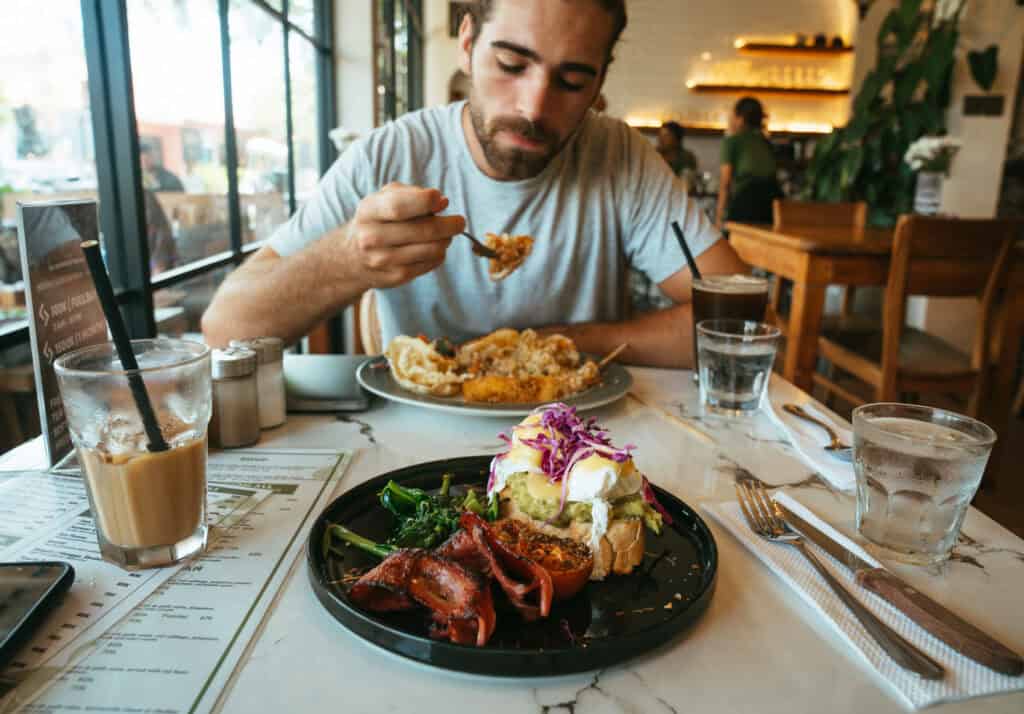 A delicious breakfast of Avocado toast with bacon and eggs from Cafe Daun in Canggu, Bali