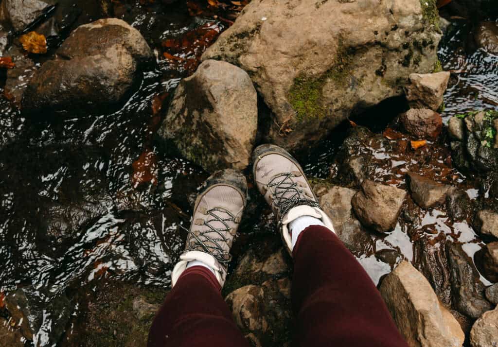 Sarah's hiking shoes in a small stream along the trail of Levade do Caldeirao Verde