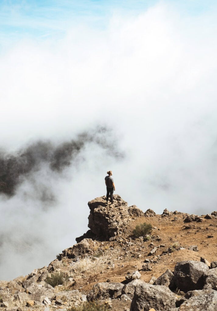 Caleb looking out into the foggy clouds from the top of the mountains in Madeira