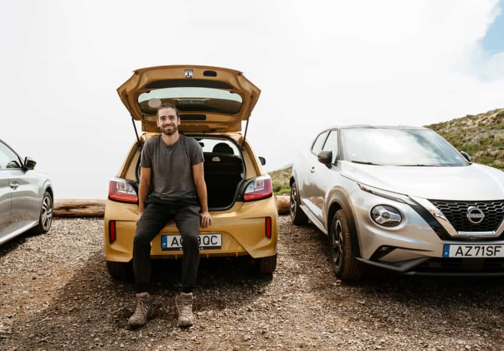 Caleb smiling from the car after driving from Funchal to Pico Do Arieiro