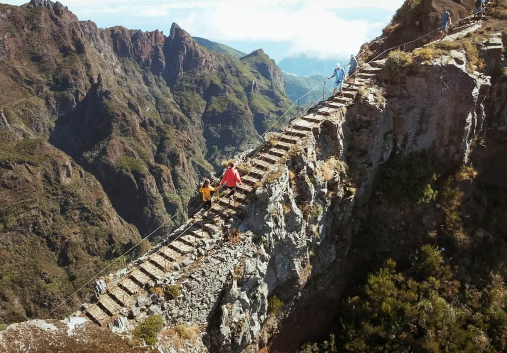 Drone view of Caleb and Sarah walking up the stairs of the famous hike at Pico do Arieiro