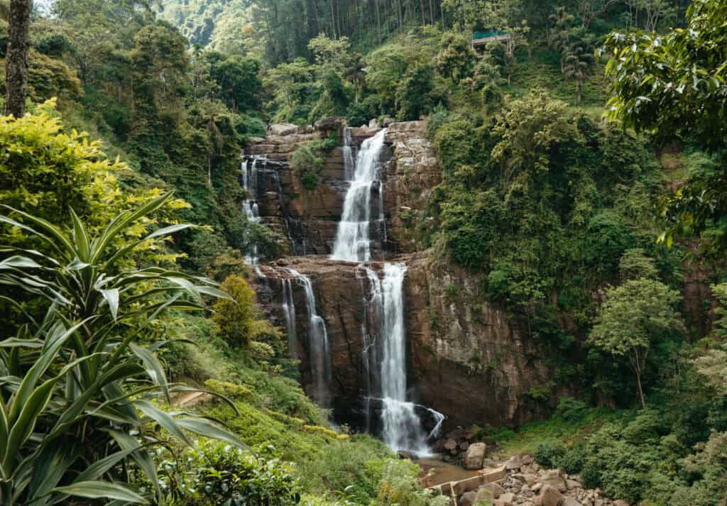 Ramboda falls, a popular one day trip from Kandy! The falls glides down the beautiful jungle rock surrounded by dense forest